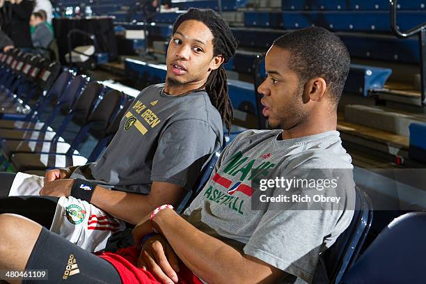 Sherwood Brown of the Maine Red Claws talks with assistant coach Ronald Nored before the game with the Springfield Armor on March 23, 2014 at the...