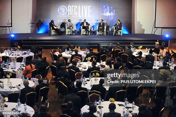 Members of a panel speaks during the African Finance Corporation's first conference on infrastructure investment in Lagos on March 25, 2014. The...