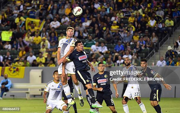 Steven Gerrard of the LA Galaxy vies for the header with Erik Pimentel of Club America in the ex-Liverpool FC legend's debut for the MLS on July 11,...