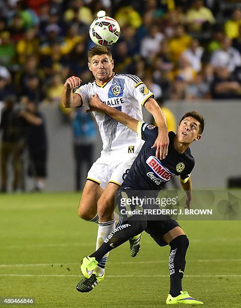 Steven Gerrard of the LA Galaxy vies for the header with Jose Daniel Guerrero of Club America in the ex-Liverpool and England international's debut...