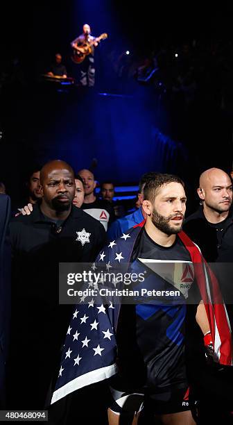 Singer Aaron Lewis performs as Chad Mendes makes his entrance to face Conor McGregor in their UFC interim featherweight title fight during the UFC...