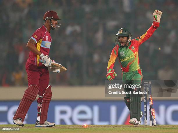 Mushfiqur Rahim of Bangladesh celebrates as he stumps Lendl Simmons of the West Indies during the ICC World Twenty20 Bangladesh 2014 match between...