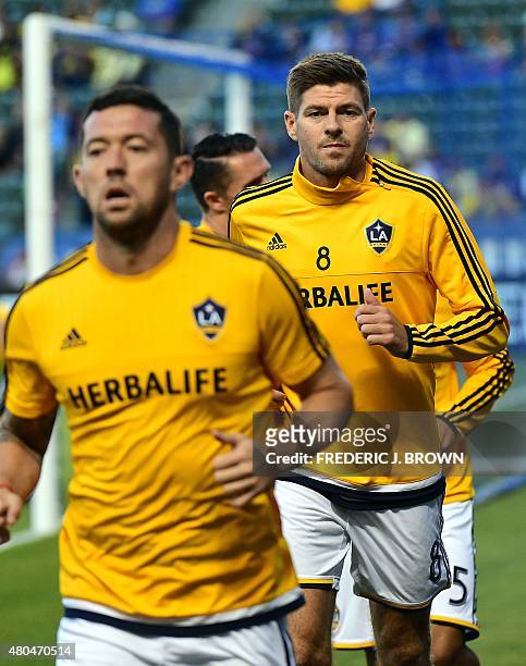 Steven Gerrard of the LA Galaxy warms up teammates before making his debut for the MLS side against Club America on July 11, 2015 in their 2015...