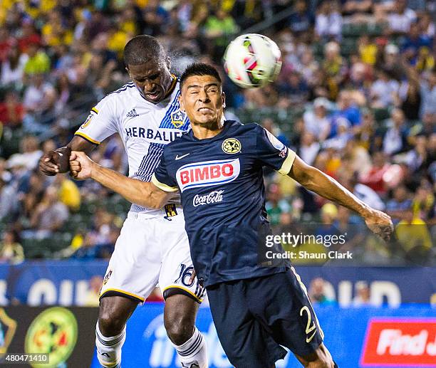 Edson Buddle of Los Angeles Galaxy heads the ball toward goal as Paolo Goltz of Club America defends during the International Champions Cup 2015...