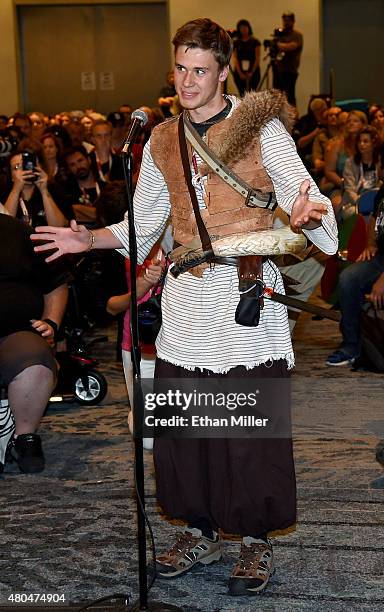 Cosplayer Walker Mundessian of California asks a question at the panel for the History series "Vikings" during Comic-Con International 2015 at the...