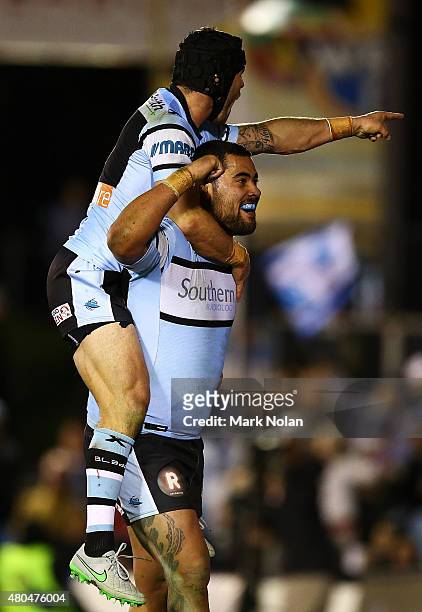 Andrew Fifita and Michael Ennis of the Sharks celebrate a try by Fifita after scoring during the round 18 NRL match between the Cronulla Sharks and...