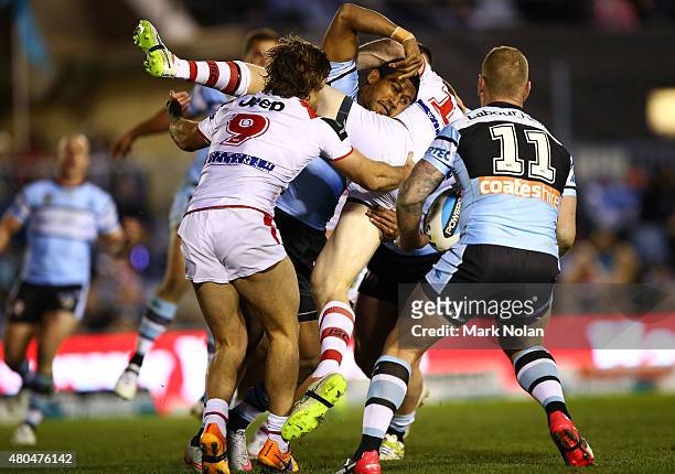 Ben Barba of the Sharks tackles Ben Creagh of the Dragons during the round 18 NRL match between the Cronulla Sharks and the St George Illawarra...