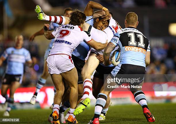 Ben Barba of the Sharks tackles Ben Creagh of the Dragons during the round 18 NRL match between the Cronulla Sharks and the St George Illawarra...