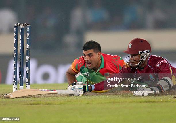 Ziaur Rahman of Bangladesh reacts after missing the stumps as he attempts to run out Marlon Samuels of the West Indies during the ICC World Twenty20...