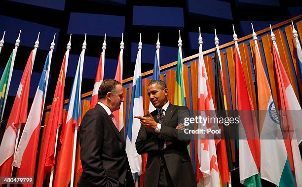 New Zealand's Prime Minister John Phillip Key, left, speaks to U.S. President Barack Obama at the closing session of the 2014 Nuclear Security Summit...