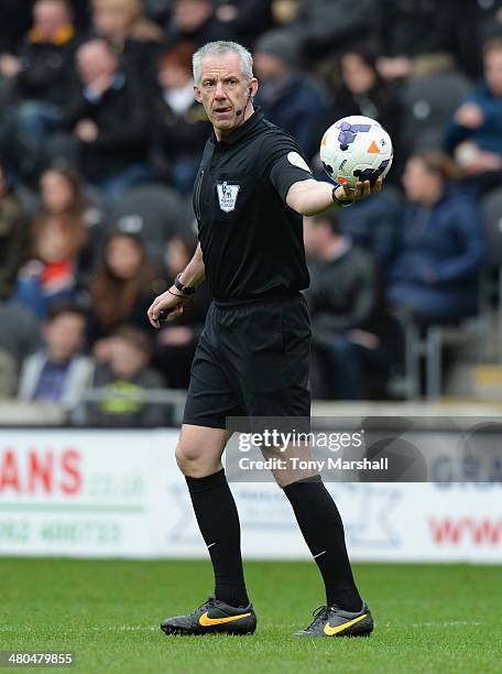 Referee Chris Foy during the Barclays Premier League match between Hull City and West Bromwich Albion at KC Stadium on March 22, 2014 in Hull,...