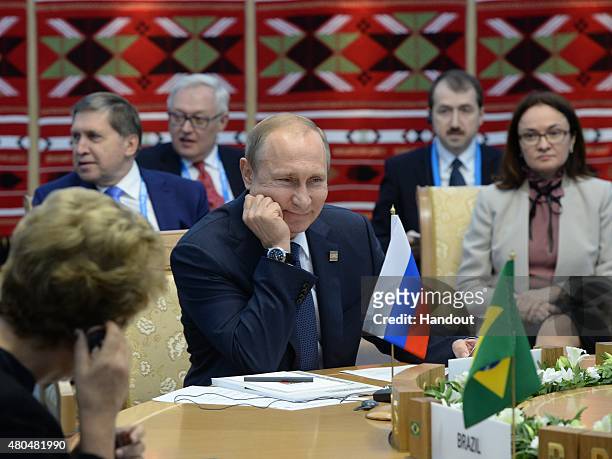 In this handout image supplied by Host Photo Agency / RIA Novosti, President of the Russian Federation Vladimir Putin at a BRICS leaders limited...