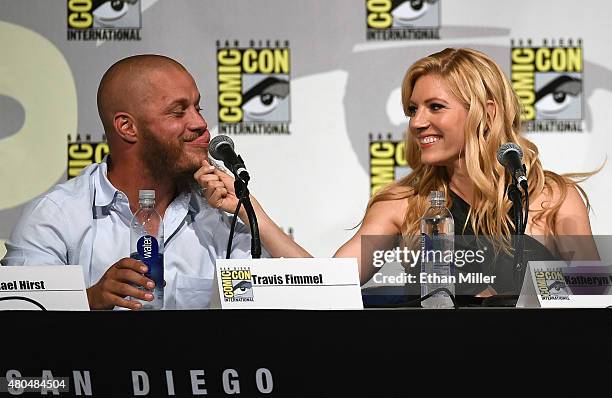 Actress Katheryn Winnick pulls on actor Travis Fimmel's beard as they joke around during a panel for the History series "Vikings" during Comic-Con...