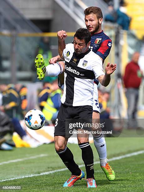 Massimo Gobbi of Parma FC competes for the ball with Marco Motta of Genoa CFC during the Serie A match between Parma FC and Genoa CFC at Stadio Ennio...