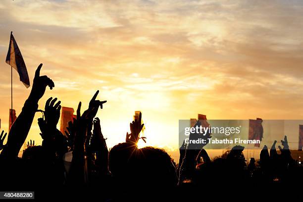 The sun sets on the festival crowd on Day 1 of the Glastonbury Festival at Worthy Farm, Pilton on June 26, 2015 in Glastonbury, England.