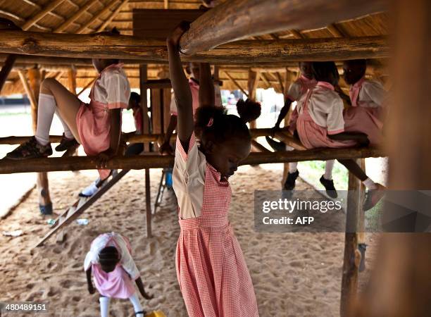 Pupils are pictured at play time at the Dr John Garang International school in Juba, on March 25, 2014. Peace talks between South Sudan's government...