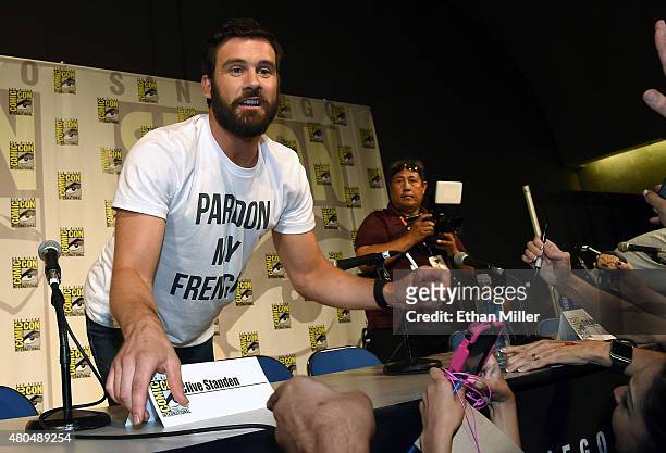 Actor Clive Standen greets fans after a panel for the History series "Vikings" during Comic-Con International 2015 at the San Diego Convention Center...