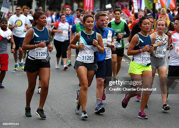 Laureus runners participate in Laureus British 10K run around central London during the Laureus British 10K on July 12, 2015 in London, England.