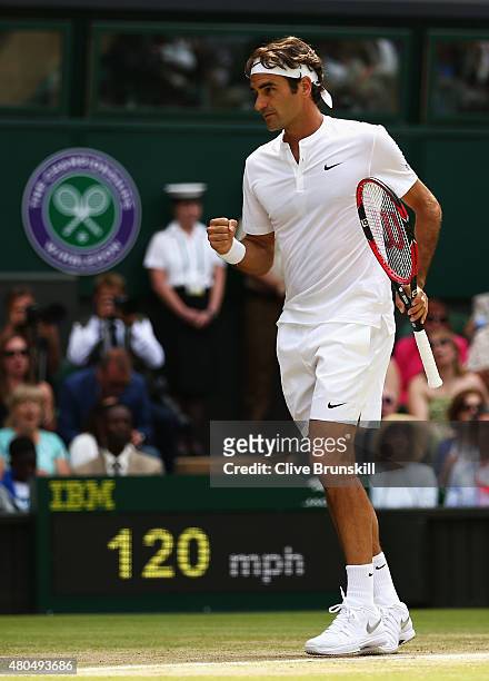 Roger Federer of Switzerland celebrates winning a point in the Final Of The Gentlemen's Singles against Novak Djokovic of Serbia on day thirteen of...