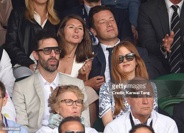 Sacha Baron Cohen, Jools Oliver, Jamie Oliver and Isla Fisher attend day 13 of the Wimbledon Tennis Championships at Wimbledon on July 12, 2015 in...