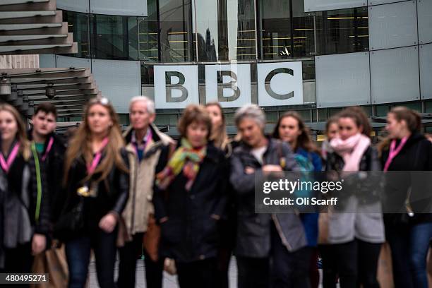 People walk past Broadcasting House, the headquarters of the BBC, on March 25, 2014 in London, England. MPs have today voted in favour of an...