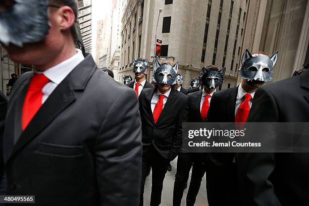 The "Wolves of Wall Street" make their way down Wall St. To mark the "The Wolf of Wall Street" DVD Release outside of the New York Stock Exchange on...