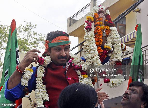 Candidate from North-east Delhi Lok Sabha constituency Manoj Tiwari during an election campaign at Rohtas Nagar Shahdra on March 25, 2014 in New...