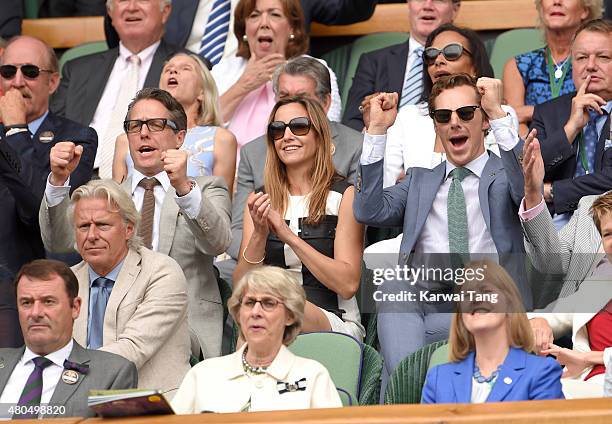 Hugh Grant, Anna Eberstein and Benedict Cumberbatch attend day 13 of the Wimbledon Tennis Championships at Wimbledon on July 12, 2015 in London,...