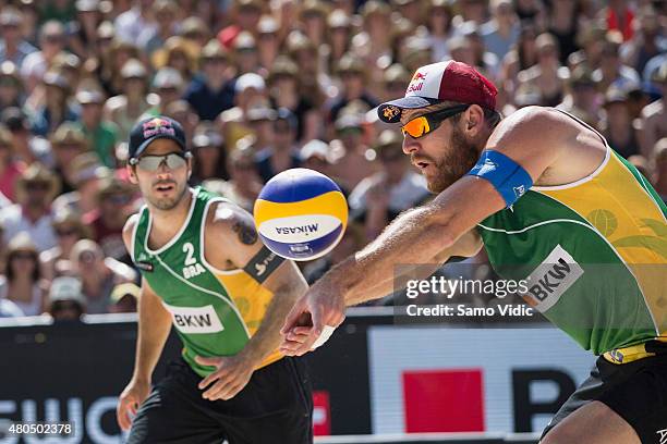 Alison Cerutti of Brasil receives the ball in a final match against Aleksandrs Samoilovs and Janis Smedins of Latvia at the Swatch Beach Volleyball...