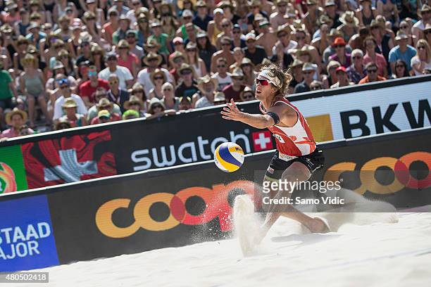 Aleksandrs Samoilovs receives the ball in a final match against Alison Cerutti and Bruno Schmidt of Brasil at the Swatch Beach Volleyball Major...