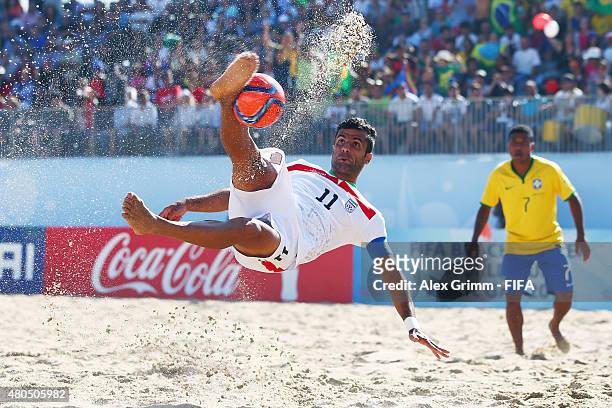 Mohammad Ahmadzadeh of Iran scores a goal with a bicycle kick during the FIFA Beach Soccer World Cup Portugal 2015 Group C match beween Iran and...