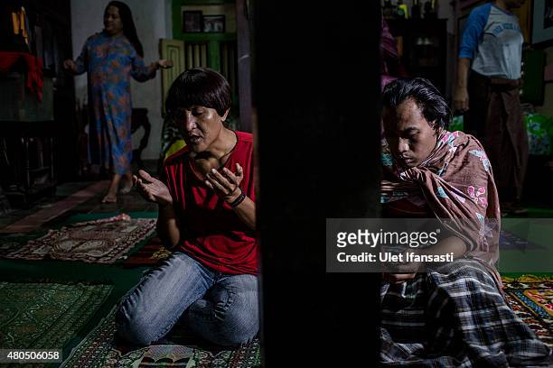 Members of a Pesantren boarding school, Al-Fatah, for transgender people known as 'waria' pray during Ramadan on July 12, 2015 in Yogyakarta,...