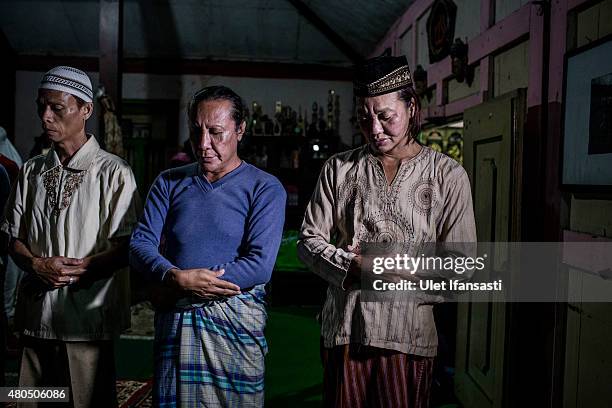 Members of a Pesantren boarding school, Al-Fatah, for transgender people known as 'waria' pray during Ramadan on July 12, 2015 in Yogyakarta,...