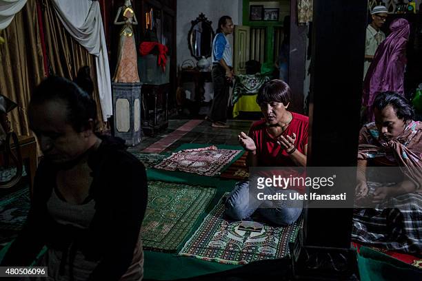 Members of a Pesantren boarding school, Al-Fatah, for transgender people known as 'waria' pray during Ramadan on July 12, 2015 in Yogyakarta,...