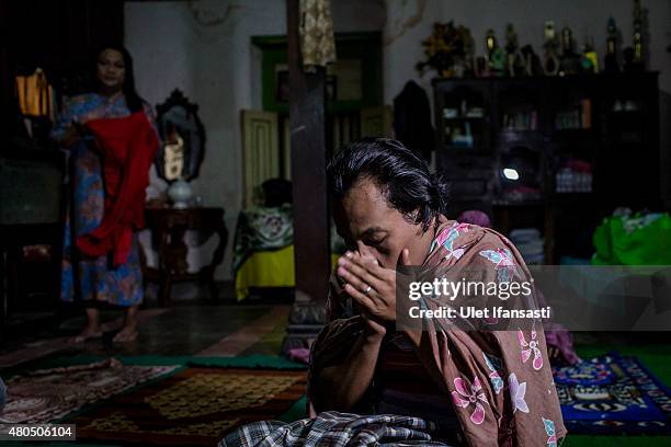 Inez, a member of boarding school for transgenders known as pesatren 'waria', called Al-Fatah, prays during observe ramadan on July 12, 2015 in...