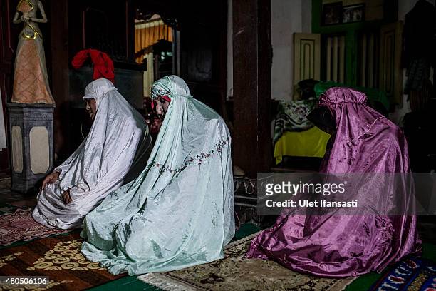 Members of boarding school for transgenders known as pesatren 'waria', called Al-Fatah, praying during observe ramadan on July 12, 2015 in...