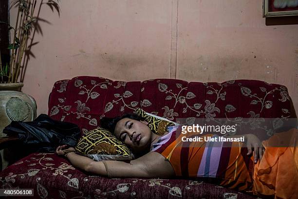 Inez, a member of a Pesantren boarding school, Al-Fatah, for transgender people known as 'waria' take a rest as waiting for break the fast during...