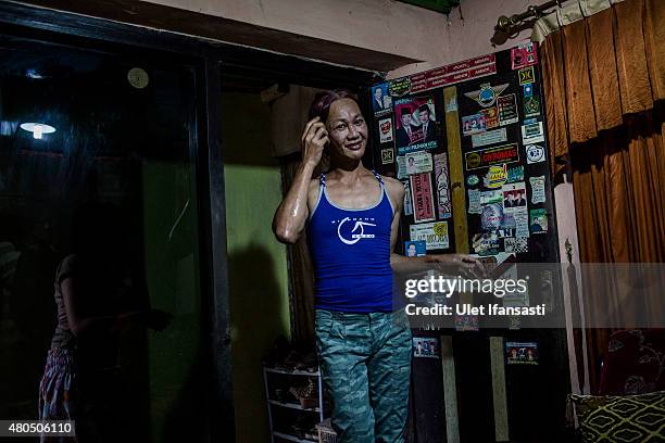 Oky, a member of a Pesantren boarding school, Al-Fatah, for transgender people known as 'waria' is seen attend during Ramadan on July 12, 2015 in...