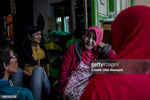 Members of a Pesantren boarding school, Al-Fatah, for transgender people known as 'waria' talking each other as waiting for break the fast during...