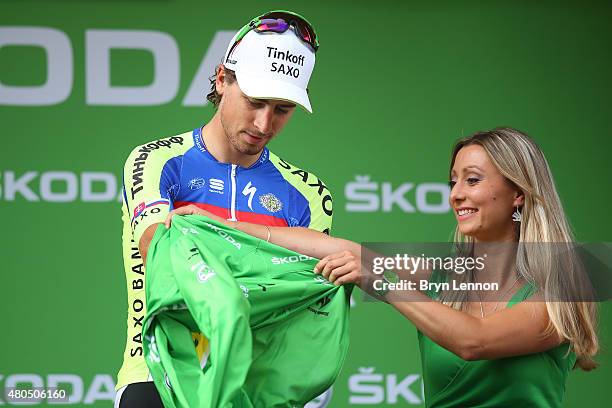 Peter Sagan of Slovakia and Tinkoff-Saxo dons the green jersey following stage nine of the 2015 Tour de France, a 28km team time trial between Vannes...