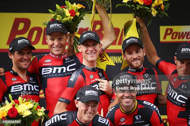 Racing Team celebrate their victory on the podium following stage nine of the 2015 Tour de France, a 28km team time trial between Vannes and Plumelec...