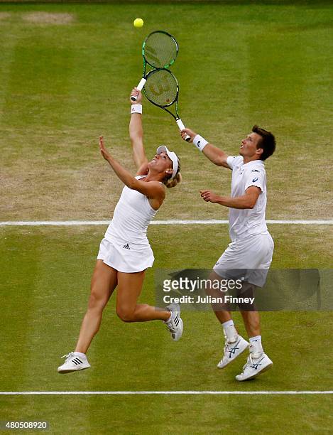 Timea Babos of Hungary and Alexander Peya of Austria in action in the Final Of The Mixed Doubles against Leander Paes of India and Martina Hingis of...
