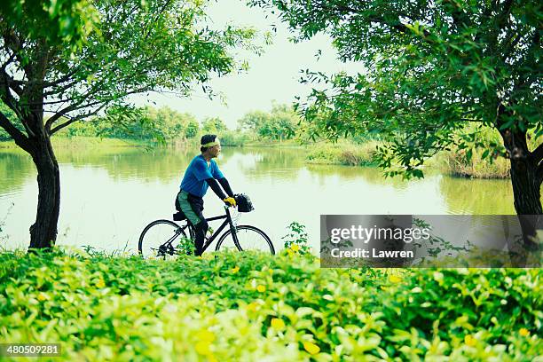 Midage Man Rides Bicycle, Foto de stock