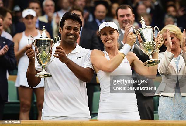Leander Paes of India and Martina Hingis of Switzerland celebrate with the trophy after winning the Final Of The Mixed Doubles against Timea Babos of...
