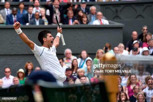 Serbia's Novak Djokovic celebrates beating Switzerland's Roger Federer during their men's singles final match on Centre Court on day thirteen of the...