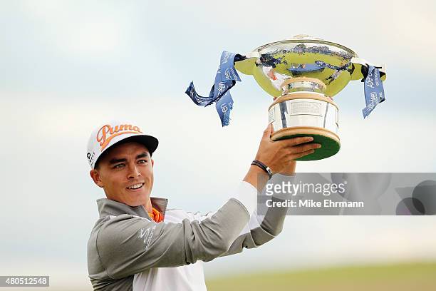Rickie Fowler of the United States celebrates with the trophy during the trophy presentation after winning the Aberdeen Asset Management Scottish...