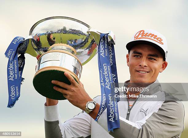 Rickie Fowler of the United States celebrates with the trophy during the trophy presentation after winning the Aberdeen Asset Management Scottish...