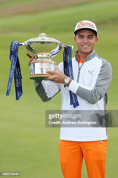 Rickie Fowler of the United States celebrates with the trophy during the trophy presentation after winning the Aberdeen Asset Management Scottish...