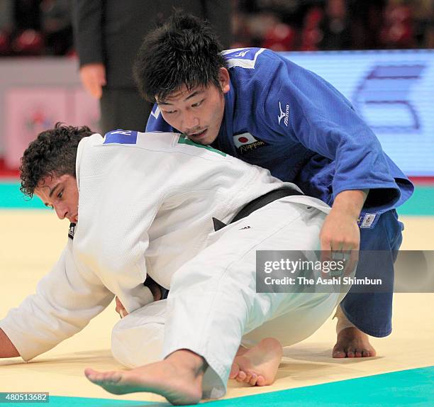 Masashi Nishiyama of Japan and Asley Gonzalez of Cuba compete in the Men's -90kg final during day two of the Judo Grand Slam Tokyo at Tokyo...