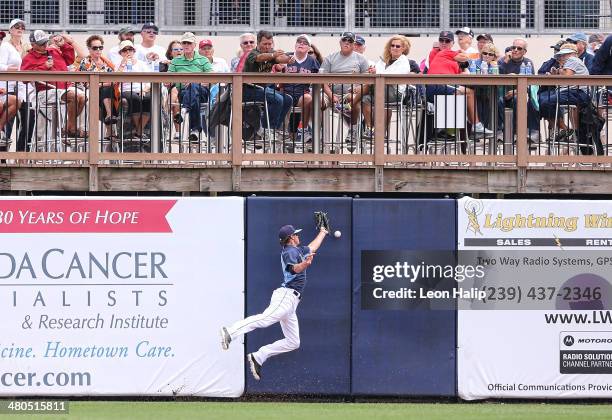 Wil Myers of the Tampa Bay Rays attempts to make the catch on the line drive from Mike Napoli of the Boston Red Sox during the fourth inning of the...